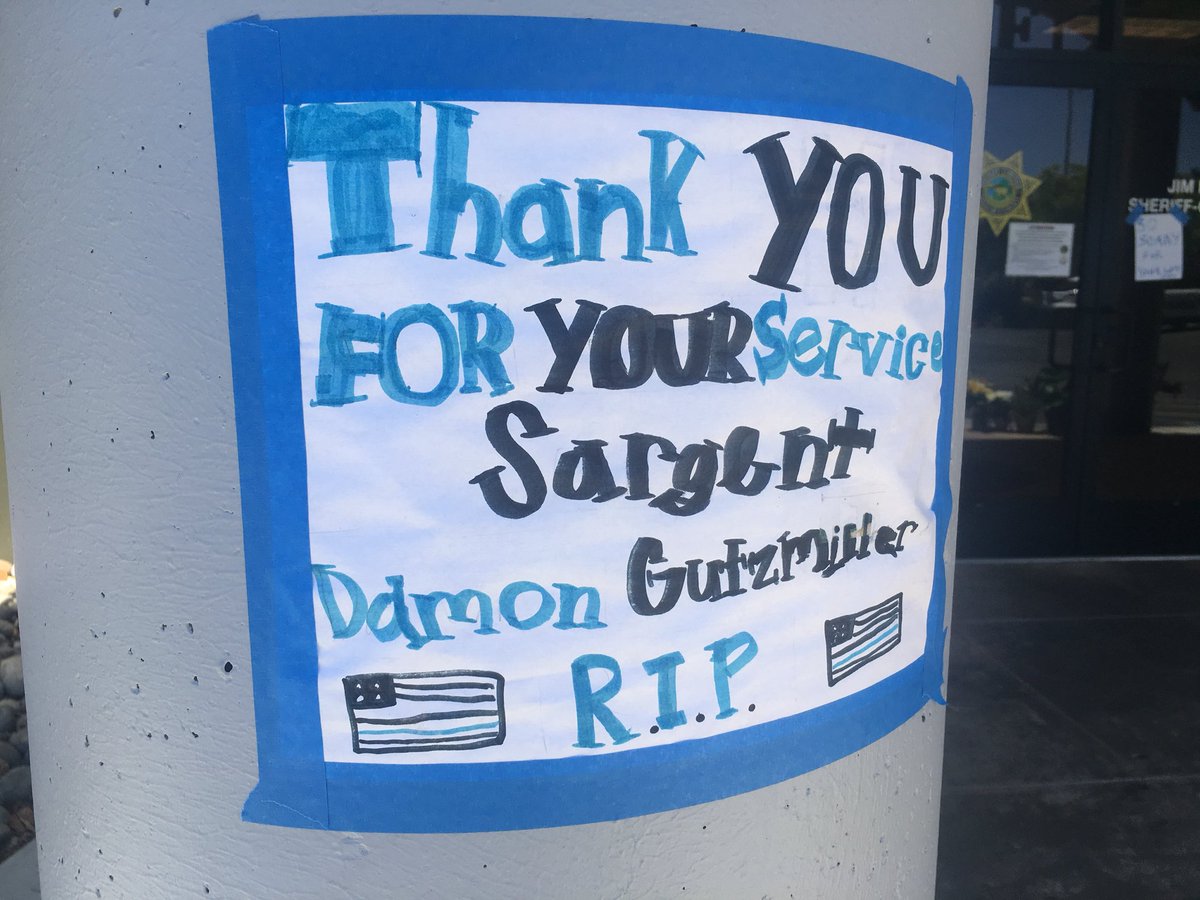 RFladeboe7's tweet photo. Memorial is growing in honor of slain #SantaCruzCo #DeputyDamonGutzwiller. Sheriff Jim Hart expected to provide new info (2 pm presser)about alleged ambush that led to Gutzwiller’s death. FBI is here looking at suspect #StevenCarrillo in connection with May 29 killing in Oakland https://t.co/T83Lu4iyRS