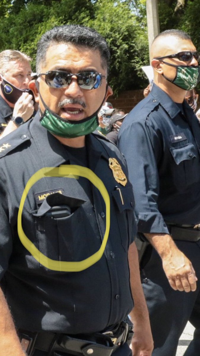 bvbpatch's tweet photo. Chief Morales walks with protestors in shameless PR stunt. But check out the chief leading by example using the old “cover-your-nametag-with-phone-in-pocket” maneuver. 👀 gtfo #MoralesOut #FireMorales #FireMattioli #DefundMPD #MilwaukeeProtest #MKE #Milwaukee #MilwaukeeProtests https://t.co/VLeWb99FT7