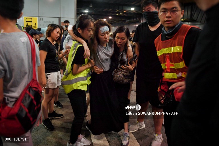 AFPphoto's tweet photo. Hong Kong protests one year on: The medic #AFP
https://t.co/HNWPs8GjoZ
📸 @AntAFP 
📸 @TheLilyfish https://t.co/ie4geLim6K