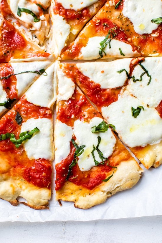 Easy Margherita Pizza made from scratch with my yeast-free, thin crust pizza dough topped with a simple raw tomato sauce, fresh mozzarella cheese, and basil. Easy Margherita Pizza “One cannot think well, love well, sleep wel buzzlefeed.com/recipebuzz/202…