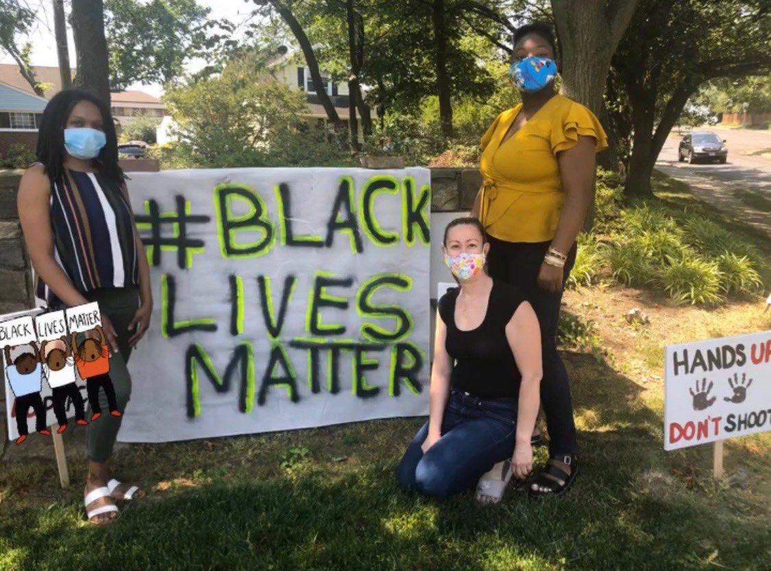 BAJCDC's tweet photo. “At BAJCDC, we’ve taken The Neighborhood Challenge by taking a team picture at the Black Lives Matter sign at South Kenmore Street and Walter Reed Drive.  We hope you’ll take this challenge with us, add a candle, flowers, or art to the display. #BlackLivesMatter  #ArlingtonVA https://t.co/5rJc3uEvIO