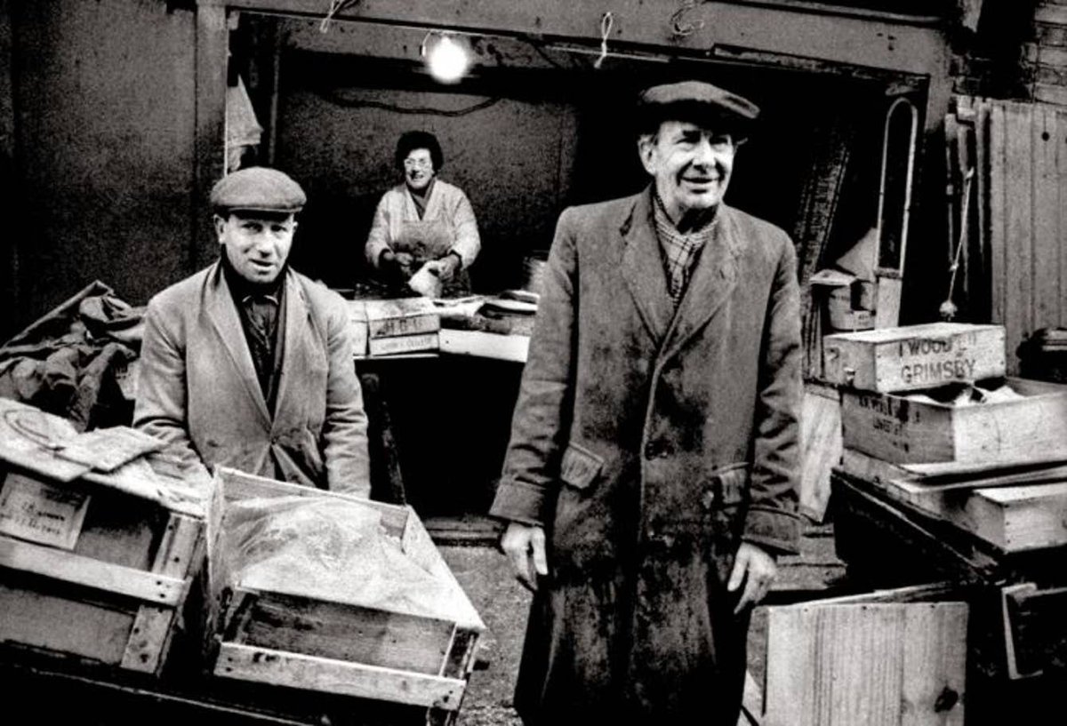 Fishmongers unloading fish from Grimsby, East End, 1966,