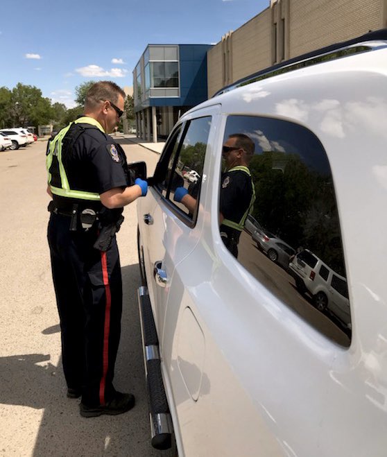 reginapolice's tweet image. Enforcement doesn’t always mean fines. 

Today, good drivers were rewarded with ‘pop from a cop’. Of 73 vehicles stopped - just 4 didn’t get a pop. Instead, they were given tickets for speeding in a school zone (including speeds up to 56 km/h in a 30 zone). #ProjectSPEED