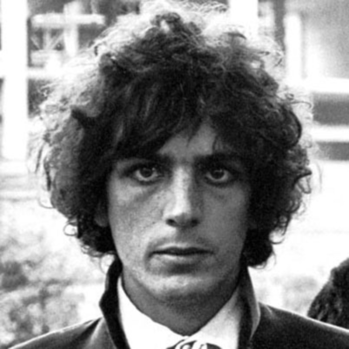 This is Syd Barrett, one of a huge number of actually schizophrenic musicians to have the "George Harrison look"