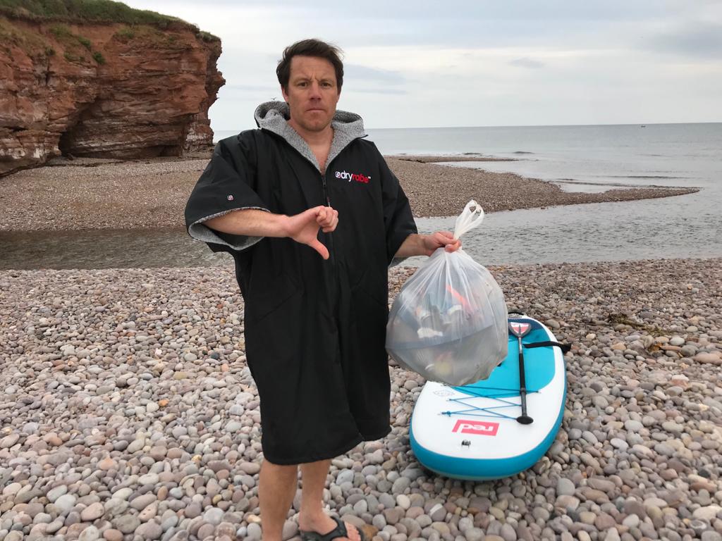 SGTMatHelm's tweet image. So aside from the fetching attire, I was having a paddle last night at #budleighsalterton. In 5 mins I filled a bag with cans, bottles, paper plates, plastic cups, etc. This did not include all the soiled wetwipes that people are doing what ever with. Take it home! #beachclean