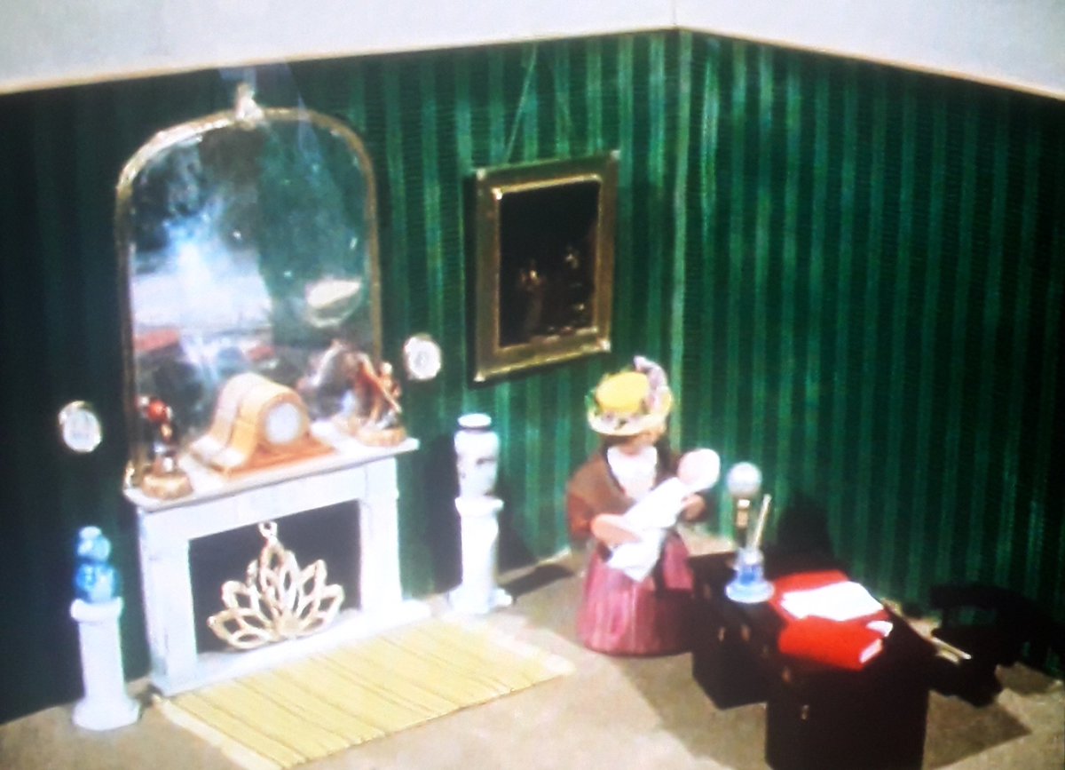 A rare glimpse of the interior of Dr. Mopp's house, suggesting a large open plan reception/surgery area, and calling to mind the front rooms described in Three Men In A Boat.