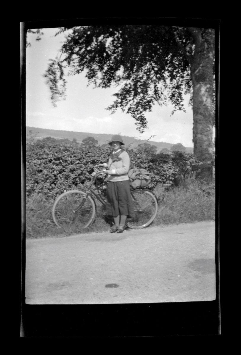 CannaFolklore's tweet photo. Been working on identifying more of Margaret Fay Shaws pics. Cycling during lockdown has doubled fm 8%-16%. She would have approved. Here she is 1926, on road west fm #Dingwall 2 Strathpeffer. Heights of Achterneed in rear @NTSCollections @N_T_S #archives #situpandbeg #BikeWeek https://t.co/pNRGwH9XOv