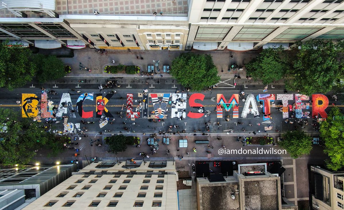 IamDonaldWilson's tweet photo. We are honored to share this tryon street with such an amazing mural 
 | Black Lives Matter Mural captured by @IamDonaldWilson | @MaleekLoyd #CLT #BLM #Mural #Uptown #BlackLivesMatter #ArtActivation https://t.co/SuMC3tDZoi https://t.co/nmmra9pN2j