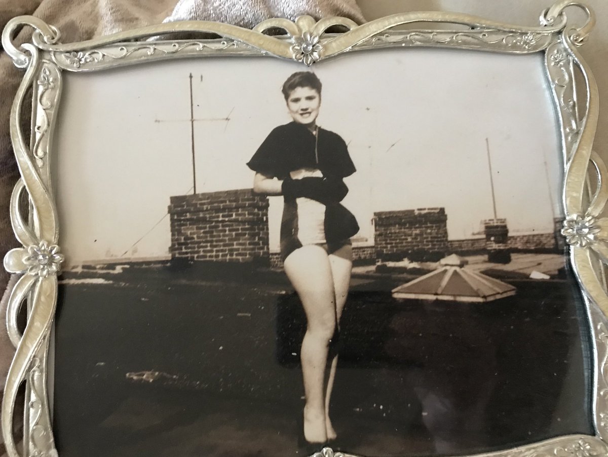 This is my mom on her roof in Brooklyn. She never thought she was pretty. I used this picture at her funeral....It would have earned me a hit with the metal spoon!! Lol.