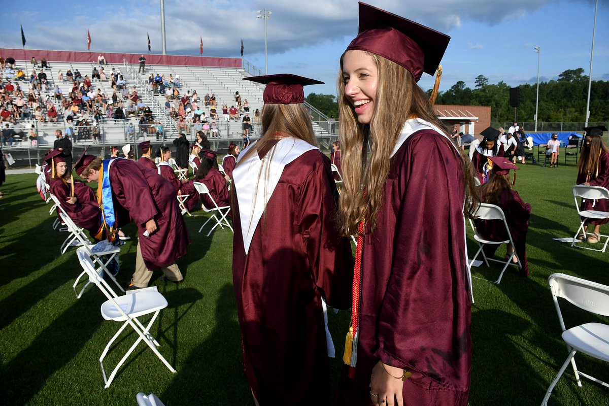 JoyBonala's tweet photo. Sprinklers going off during @TeamDDTwo Ashley Ridge High commencement are "icing on the cake" for class of 2020. See full gallery: https://t.co/5dPK8D9yWz https://t.co/gj0YbjeDhU