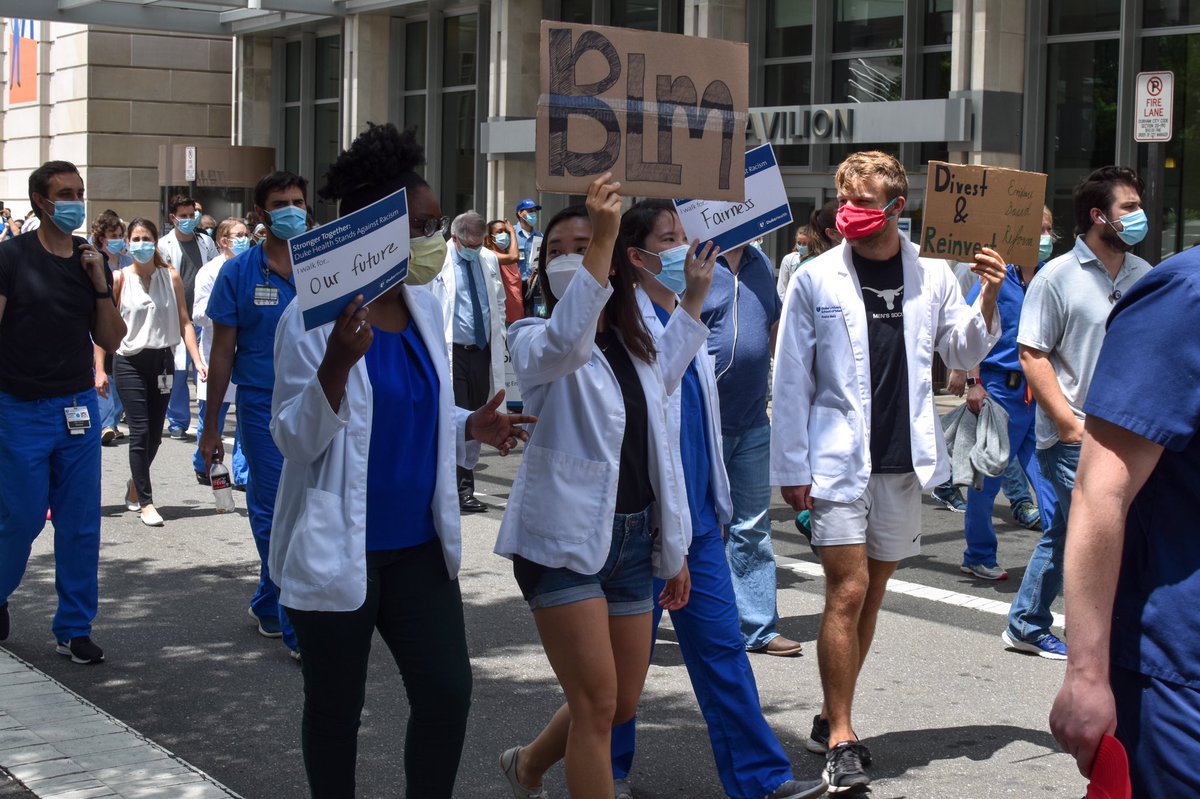 DukeHospital's tweet photo. Today, we gathered in solidarity to stand against racism. We walked together to reach across divisions and take a step to create an equitable society. During the @DukeHealth “Moment to Movement” walk, team members advocated for change to address racism and social disparities. https://t.co/GdR2JmUwFm