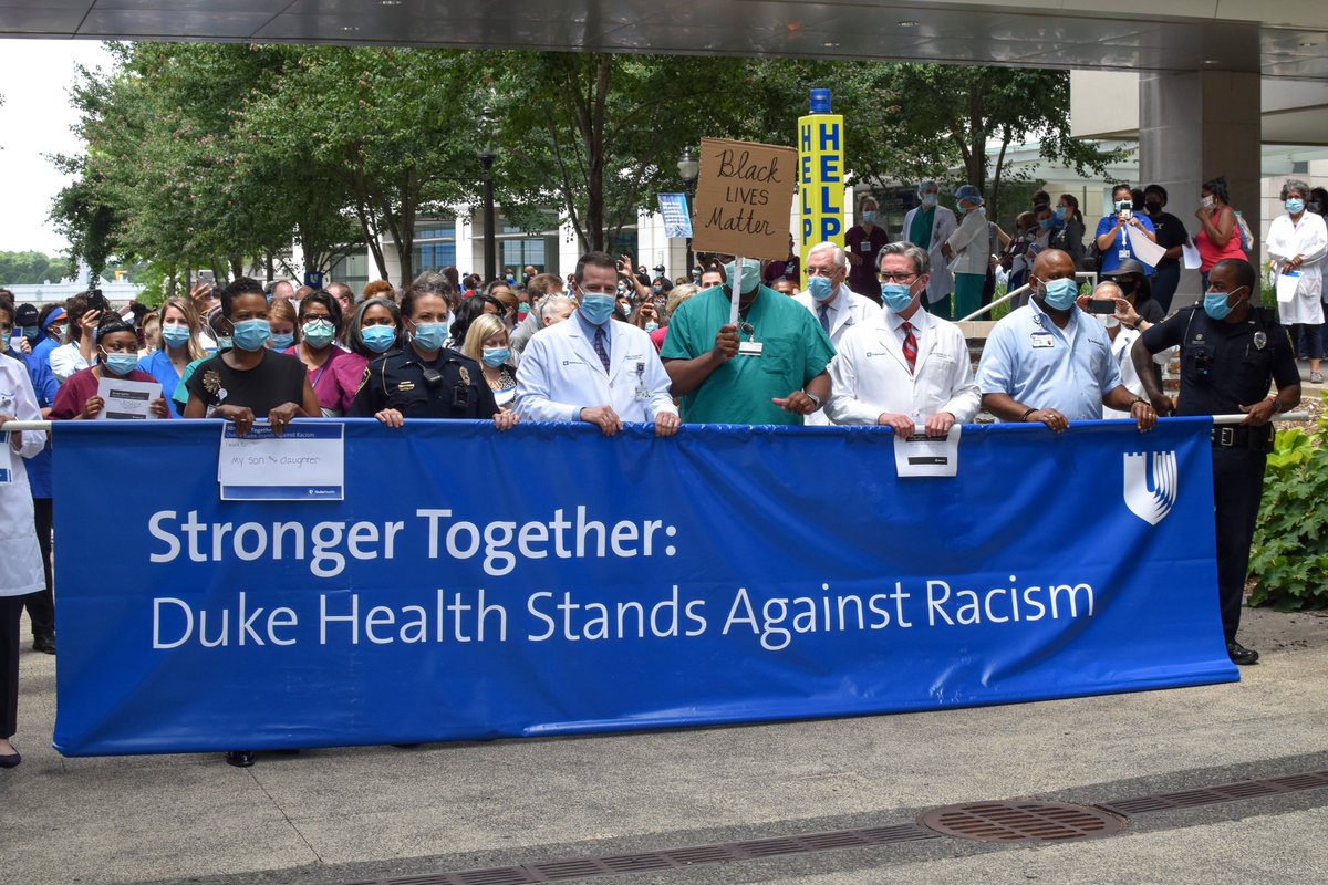 DukeHospital's tweet photo. Today, we gathered in solidarity to stand against racism. We walked together to reach across divisions and take a step to create an equitable society. During the @DukeHealth “Moment to Movement” walk, team members advocated for change to address racism and social disparities. https://t.co/GdR2JmUwFm