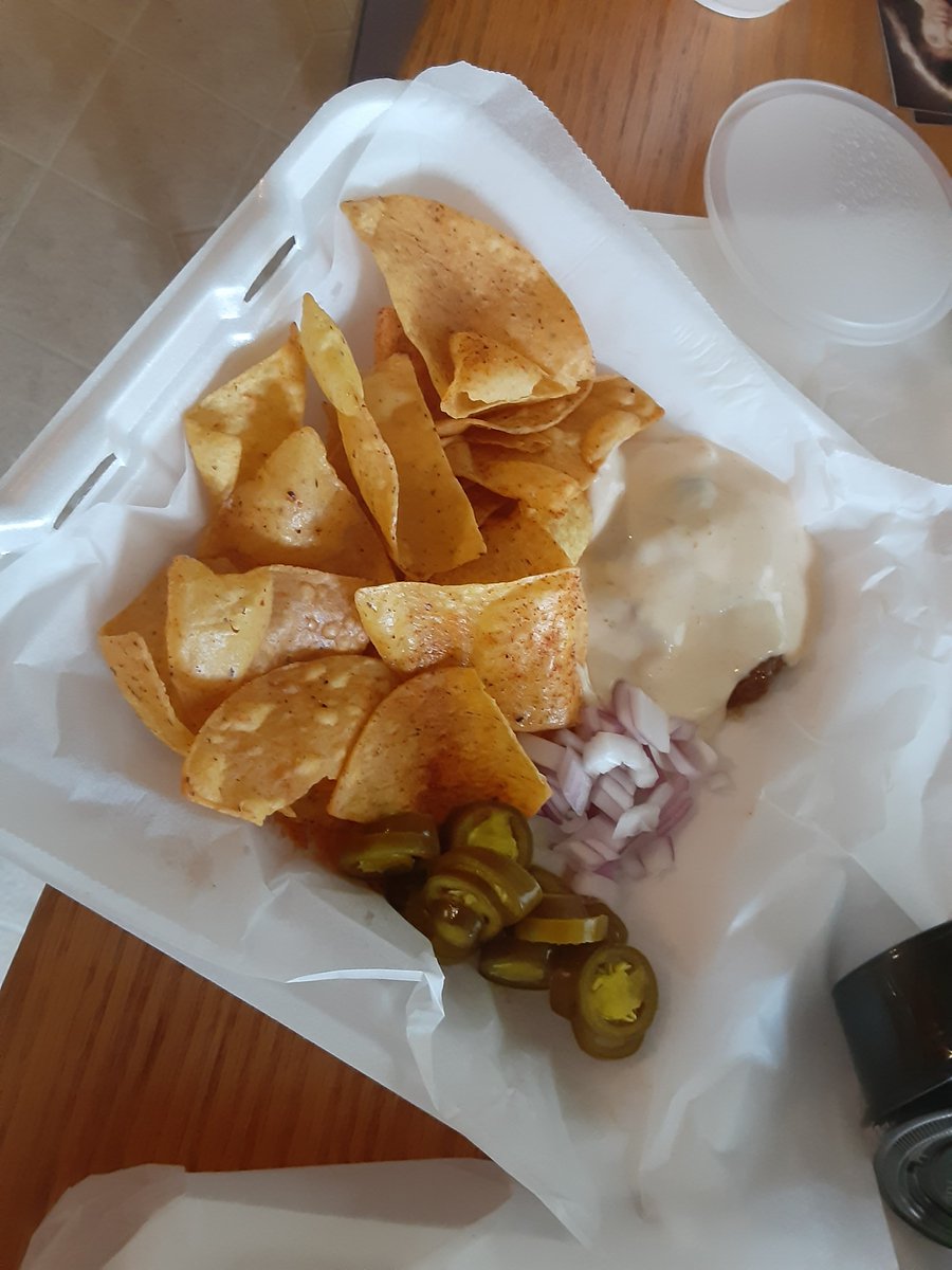 BandoPretzel's tweet photo. We hit Boone's Saloon tonight for Nacho/Taco Food Week. Their feature was the BBQ Nachos. I covered the BBQ with the cheese in this pic. They were solid. #217foodweek https://t.co/gvnHlMqkFe