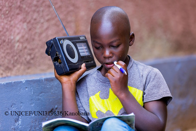 UNICEFEducation's tweet photo. KEEP CHILDREN LEARNING.

When schools closed in #Rwanda due to #COVID19, the immediate solution to ensure continued learning was radio lessons 📻, developed with support from @unicefrw!

Here, Igihozo Kevin, 11, listens to his daily Primary 5 lessons on the radio. https://t.co/ebnvZYuWL6