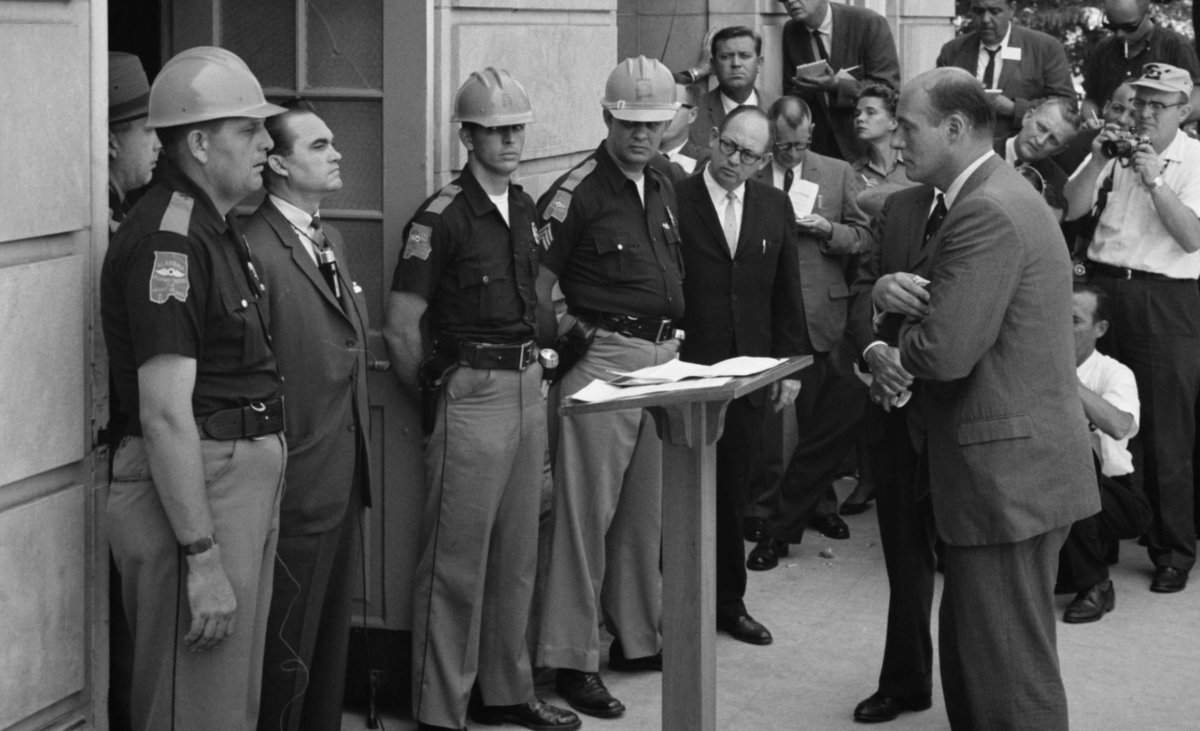 Historical photo of Governor Wallace standing in the schoolhouse door at the University of Alabama.