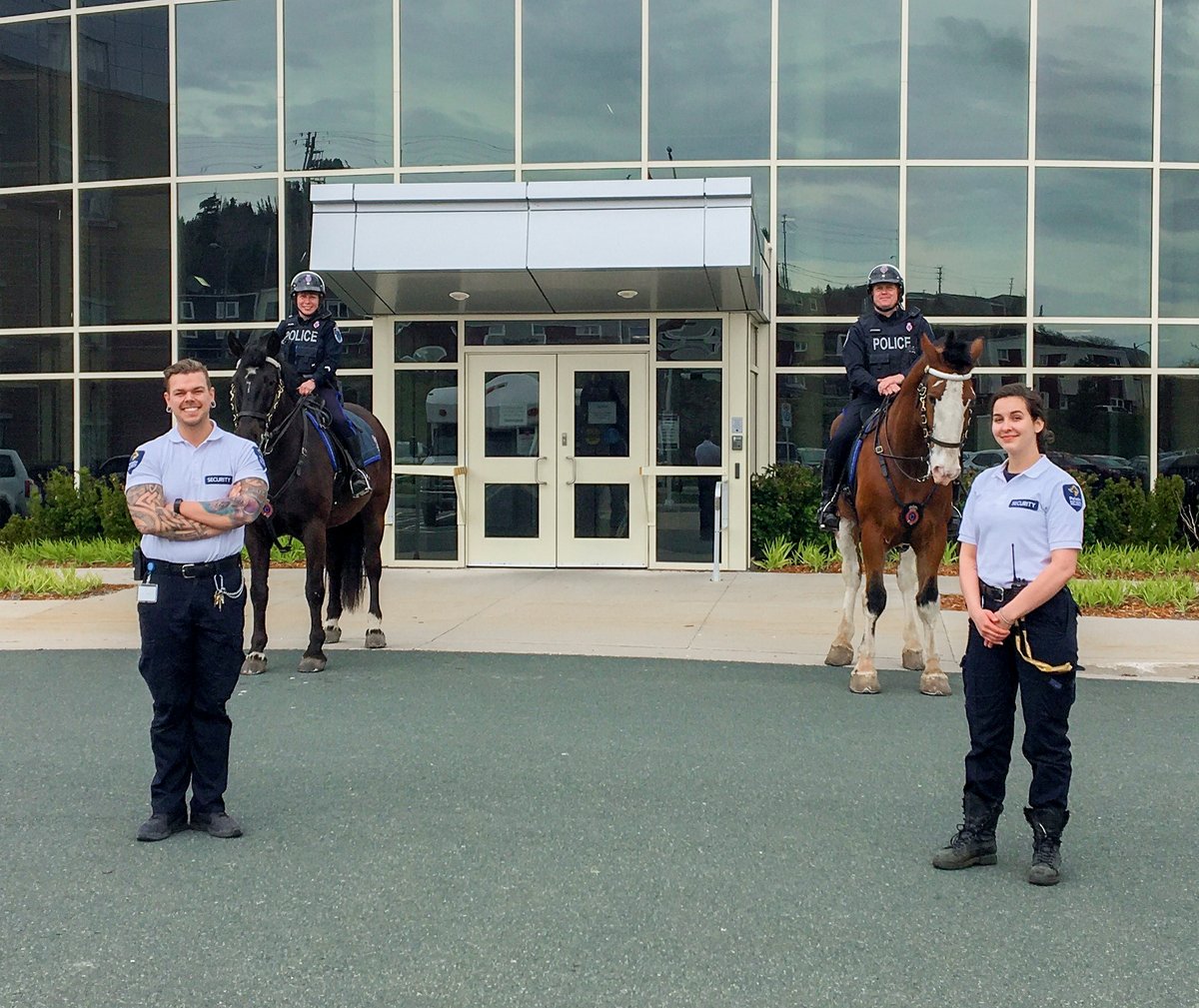 Site Supervisor Andy Ball and Team Lead Christina Dziadura snapped a photo with the <a href="/RNC_PoliceNL/">Royal Newfoundland Constabulary</a> at Pleasant View Towers. The RNC were there to cheer up long-term care residents with window visits! #Security #RNC #COVID19 #StJohns