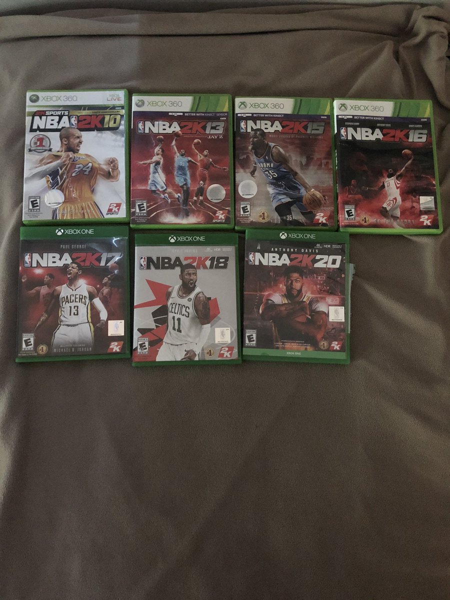 CJUSTICE00's tweet photo. My NBA 2k Collection! I had 2k11 but I sold that game, never owned 2k14 but I played it, I own 2k12 on my PSP and 2k19 is on my Xbox!! Iโve been playing this game for 10 years ๐ณ #NBA2K #2k #2kCommunity #2kfreeagent #2kmfromhome #2KTVSWAG https://t.co/RQ3YyLwYMC