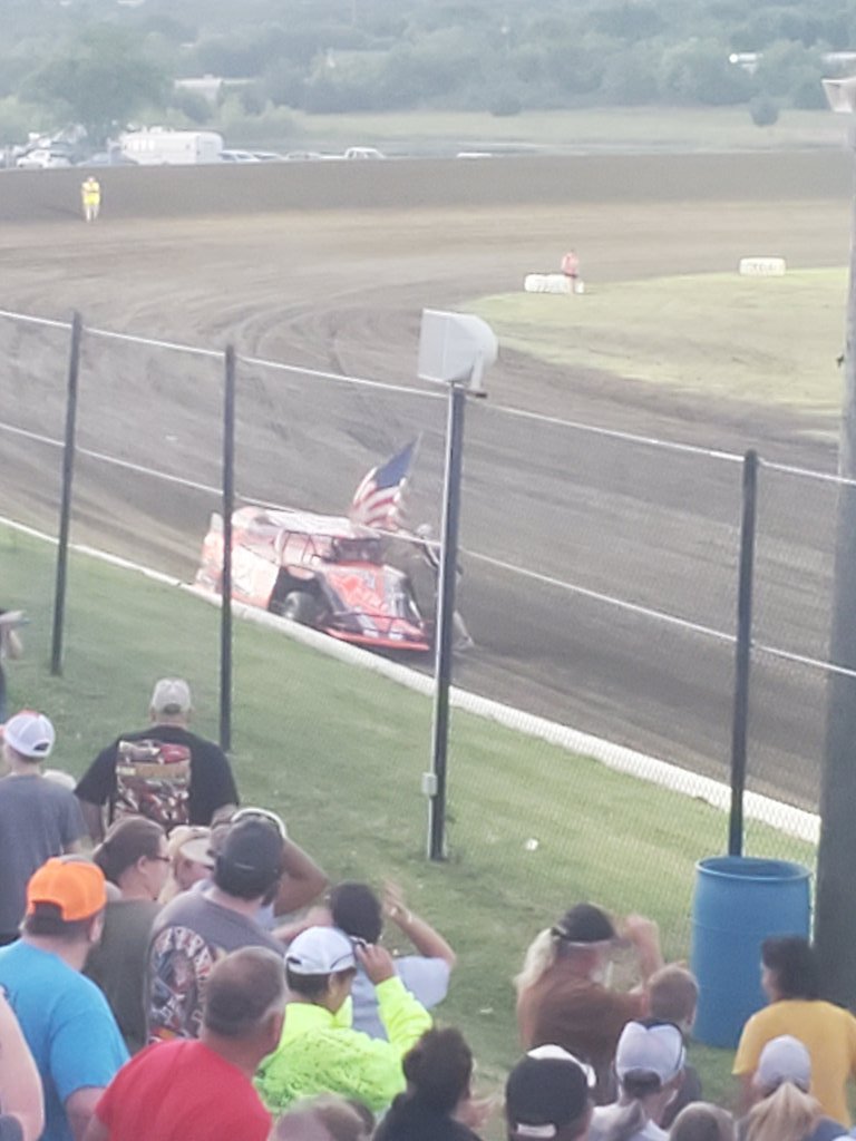 Southern Oklahoma Speedway with <a href="/Kenny_Wallace/">Kenny Wallace</a> carrying the Stars and Stripes.