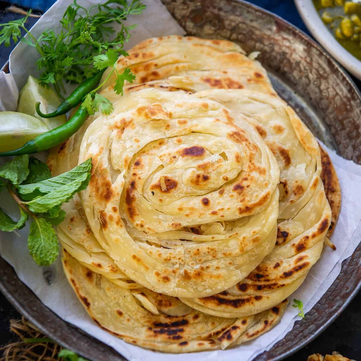 ComradeMallu's tweet photo. "First they came for Pazhampori and Appam.

Now they came for Kerala Porotta."

#HandsOffPorotta https://t.co/3nIK5aeQIh
