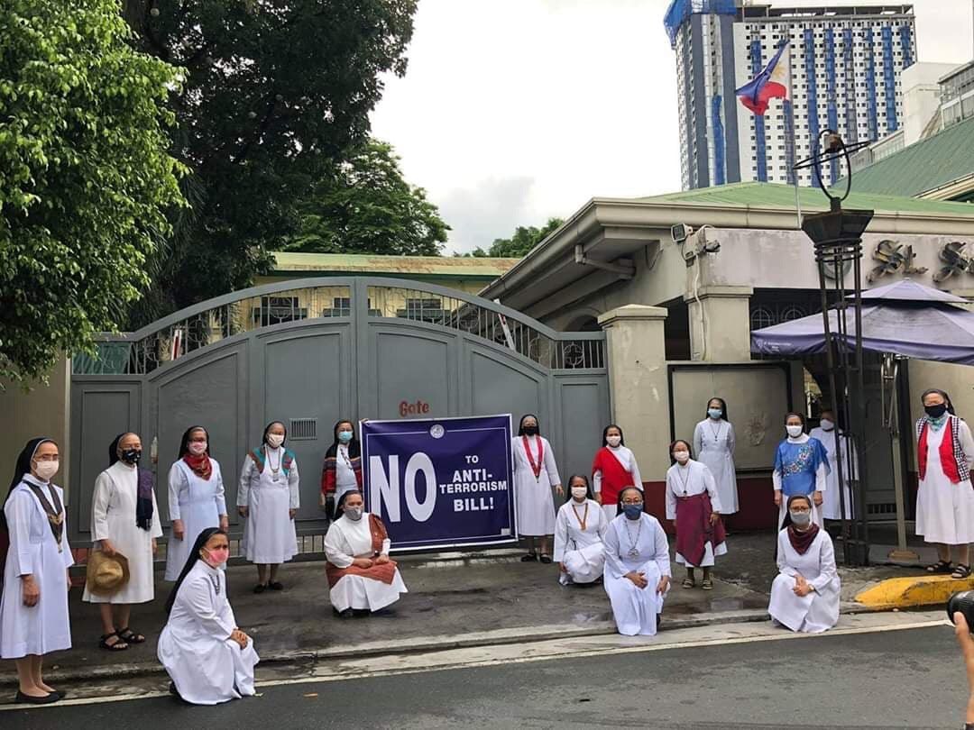 natoreyes's tweet photo. Benedictine nuns from St. Scho stand against the terror bill while observing physical distancing. #JunkTerrorBillNow https://t.co/P3HsAqbgUM