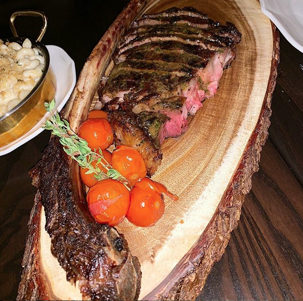 BullAndBourbon's tweet photo. Flashback Friday to our Dry Aged Tomahawks! #bullandbourbon https://t.co/UiqHPEIdB9