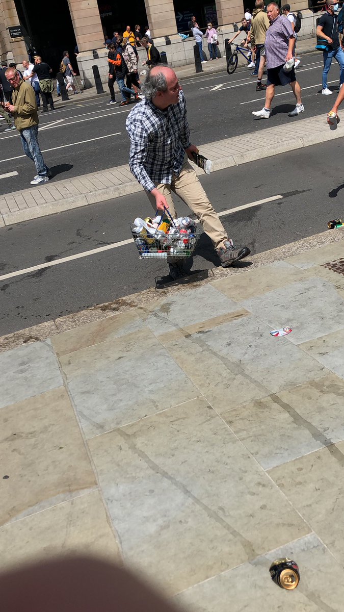 This man has come to collect the debris left behind by demonstrators. He has been working for the last couple of hours under the sun, ferrying cans and bottles from the square to nearby bins.He asked that I mention the cutting of black history courses at SOAS.