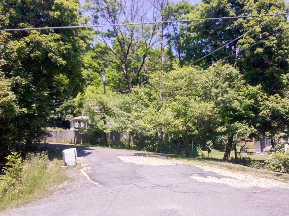 Let's cross the bridge. Now we're within city limits (what, you can't tell?). More brick bursts from beneath the pavement. We hit a fork, let's follow it straight.