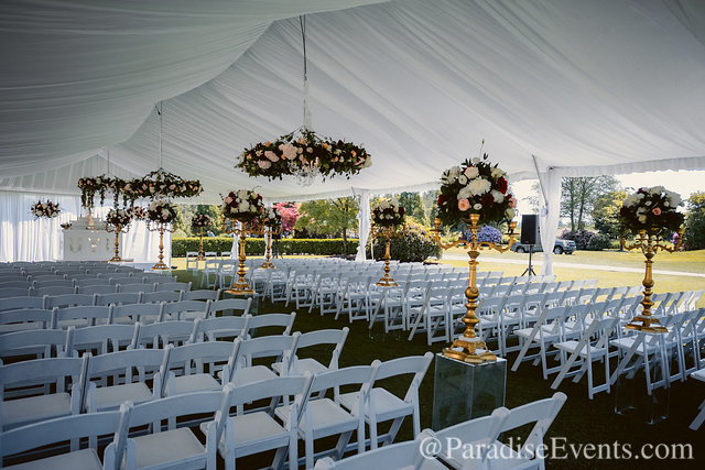 Paradise Events added beautiful flowers to the tent Phoenix Tents setup at Swaneset.  40x100 with tent Liner and Leg drapes.  The tent is the structure for the talented decor people.  Having a planner is key to getting it all done on time.  bit.ly/2XcN2m3 

#PhoenixTents