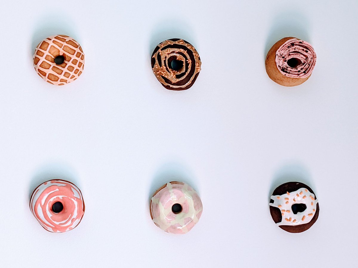 gnufmuffin's tweet photo. We bought these gorgeous, ceramic donuts from Catherine McMillan @catlovescake at The Artist Project art show back in February. Finally put them up in our living room this morning! Read about her process: https://t.co/XJn7vD8TWP https://t.co/jJI0Jz0lC9