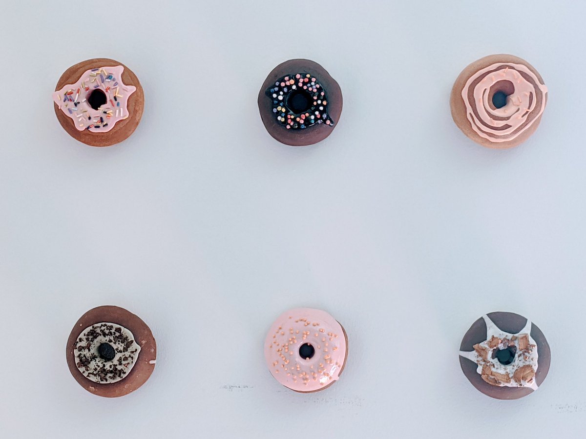 gnufmuffin's tweet photo. We bought these gorgeous, ceramic donuts from Catherine McMillan @catlovescake at The Artist Project art show back in February. Finally put them up in our living room this morning! Read about her process: https://t.co/XJn7vD8TWP https://t.co/jJI0Jz0lC9