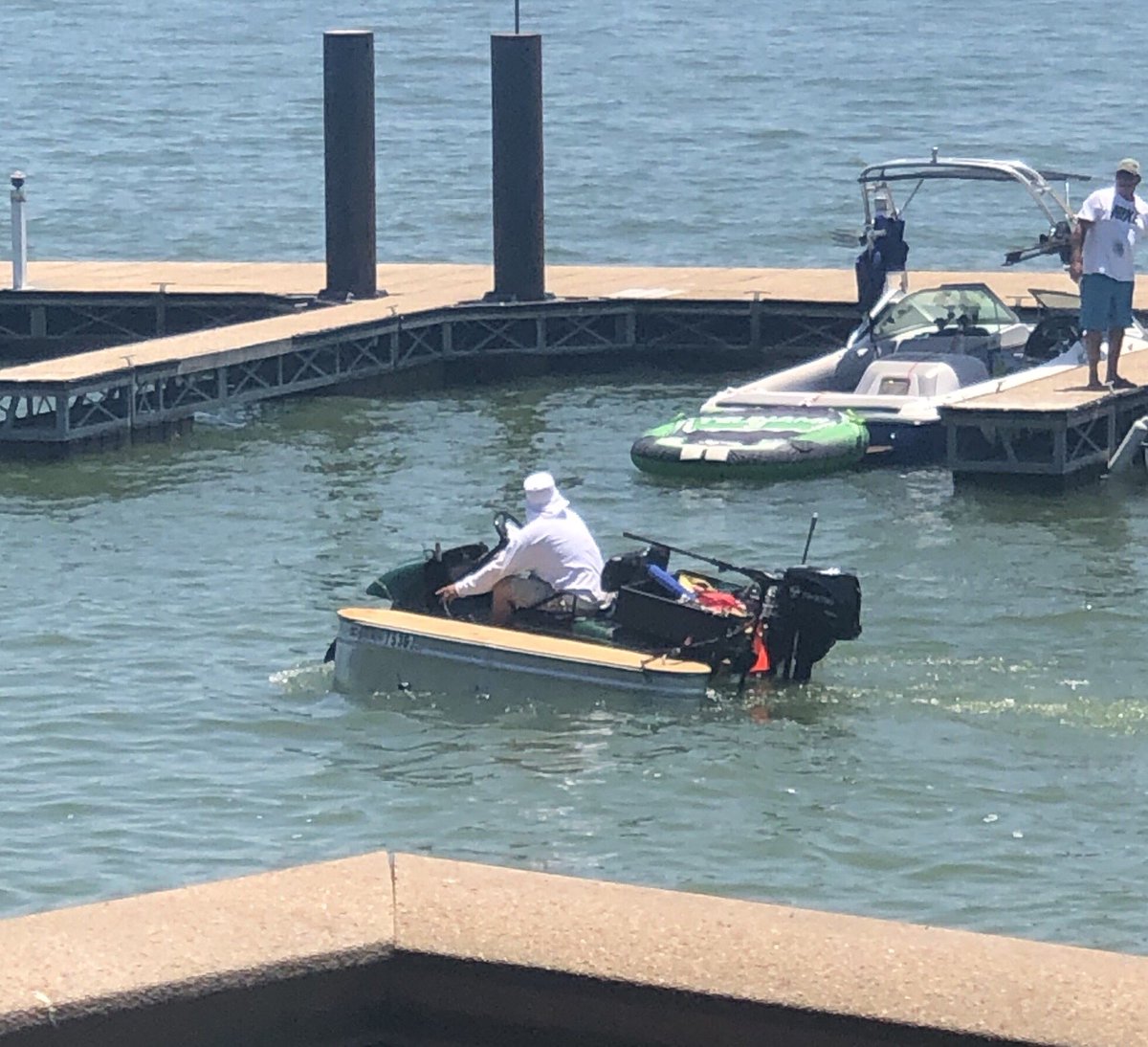 VeronicaL5209's tweet photo. Y’all....we went for a motorcycle ride, stopped for lunch on the lake bc that’s just what we do and THIS is what we got to see. That is either a Gator /Golf Cart with feed troughs as the pontoons and an outboard motor. #nowords #onlyinTX https://t.co/mb0bRORoPB