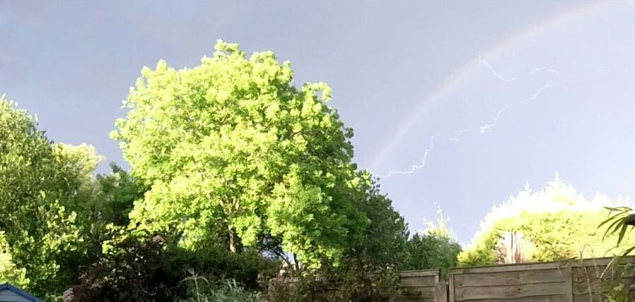 mrtimmt's tweet photo. Rainbow and lightning - strange weather, strange times https://t.co/gzAYbfHHRA