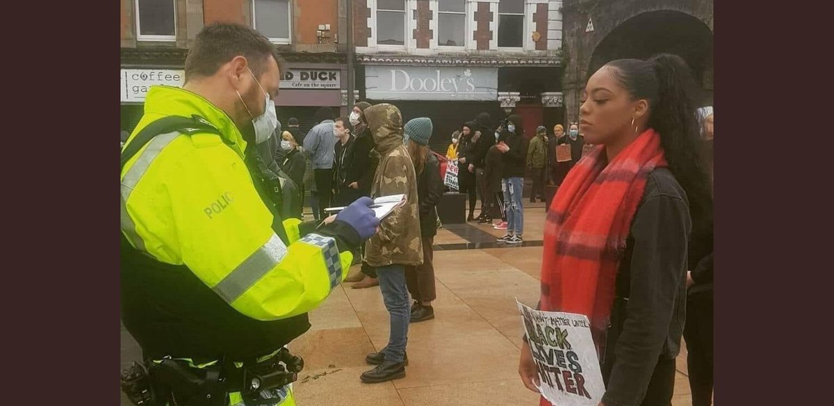 squinteratn's tweet photo. A socially distancing black woman in Derry. Fast forward a week and loyalist statue-protectors are left gloriously unbothered by police. I really think @ChiefConPSNI and @naomi_long need to say something about this. https://t.co/IQrUfjT9j9