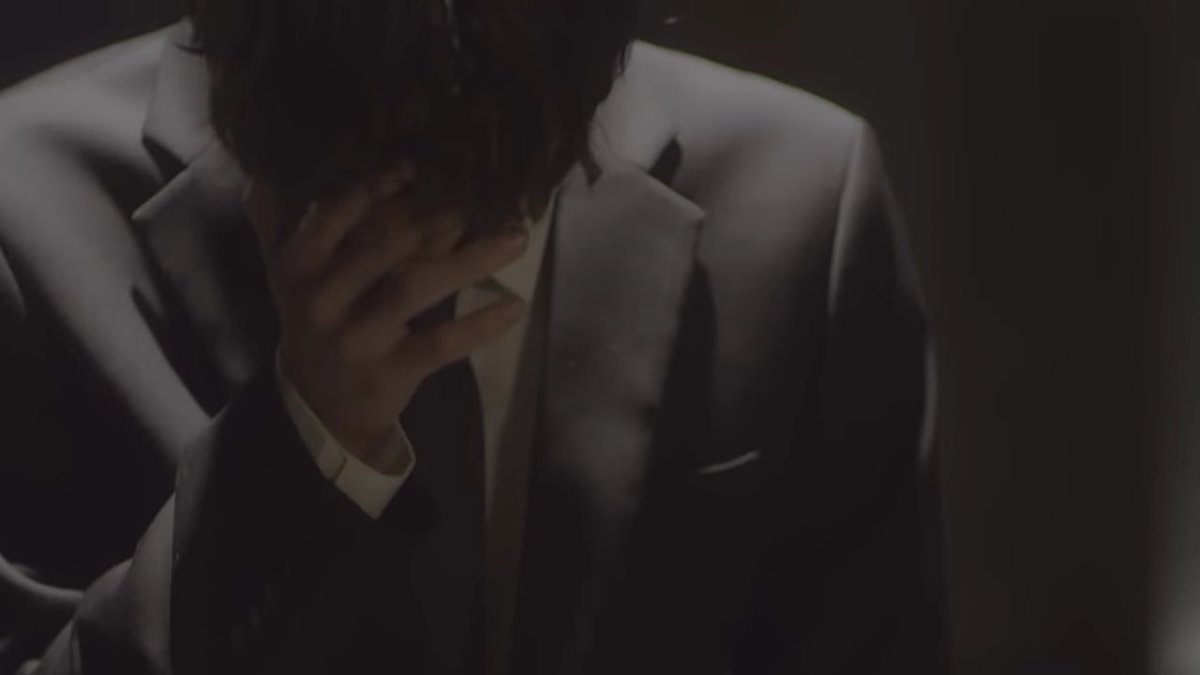 at the end of the mv, the scene that marked me the most, and the one where baejin cries in front of the chair. we can already see that he is wearing a black suit. even if the song is about love, the black costume can be used during someone's funeral, since the-