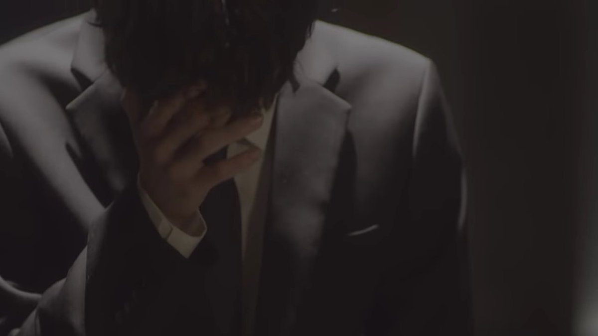 at the end of the mv, the scene that marked me the most, and the one where baejin cries in front of the chair. we can already see that he is wearing a black suit. even if the song is about love, the black costume can be used during someone& #39;s funeral, since the-
