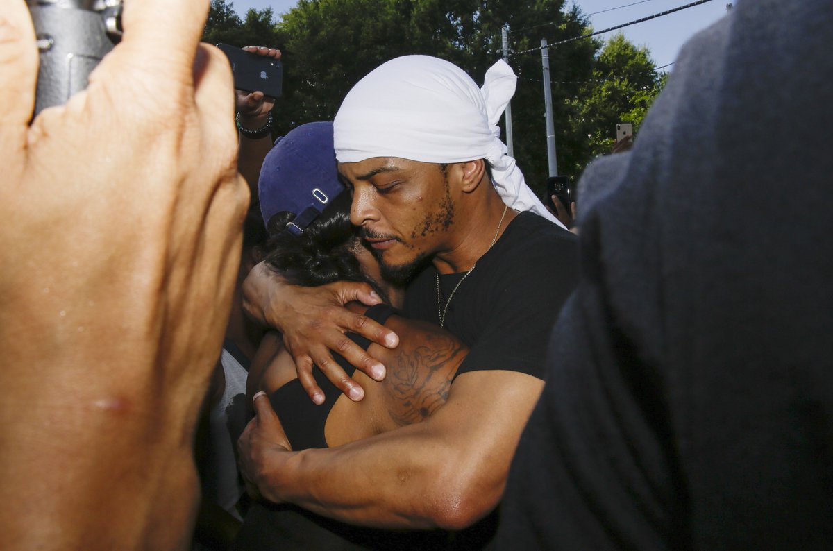 wsbtv's tweet photo. Rapper T.I. hugs a family member of Rayshard Brooks outside the Wendy's where he was killed. PHOTOS: https://t.co/BOom2dGcXq https://t.co/XFeLTIR7mw