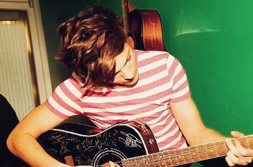— playing guitar :,)