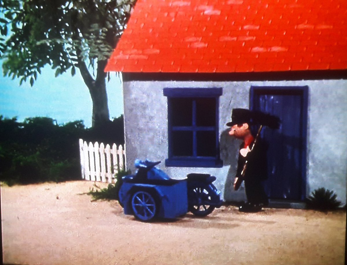 Roger Varley's Cottage. Nicely shabby look, especially on the battered front door, which is presumably deliberately in line with his character.