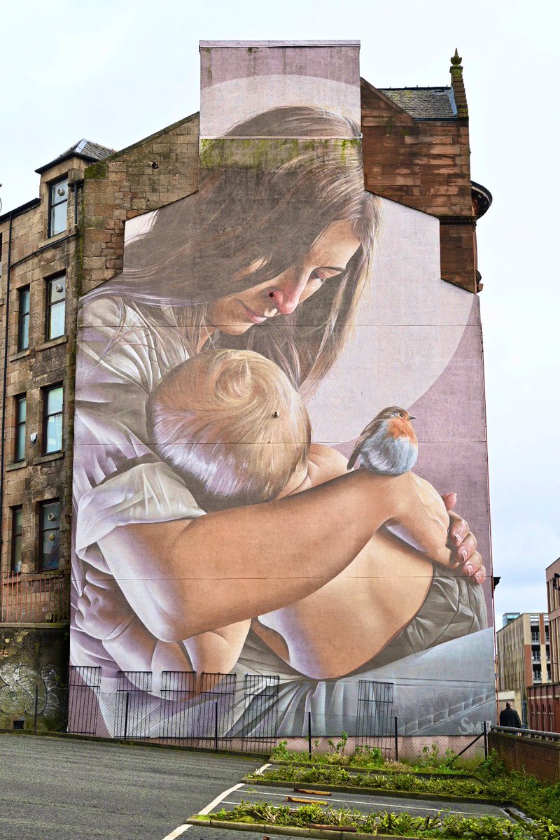 Street art from opposite ends of the city for today’s  @womenslibrary  #WomenMakeHistory post. In the west, a woman kneels amongst flowers. In the east, another woman cradles her child. This is a modern day representation of St Mungo and his mother, St Enoch (aka Thenue).