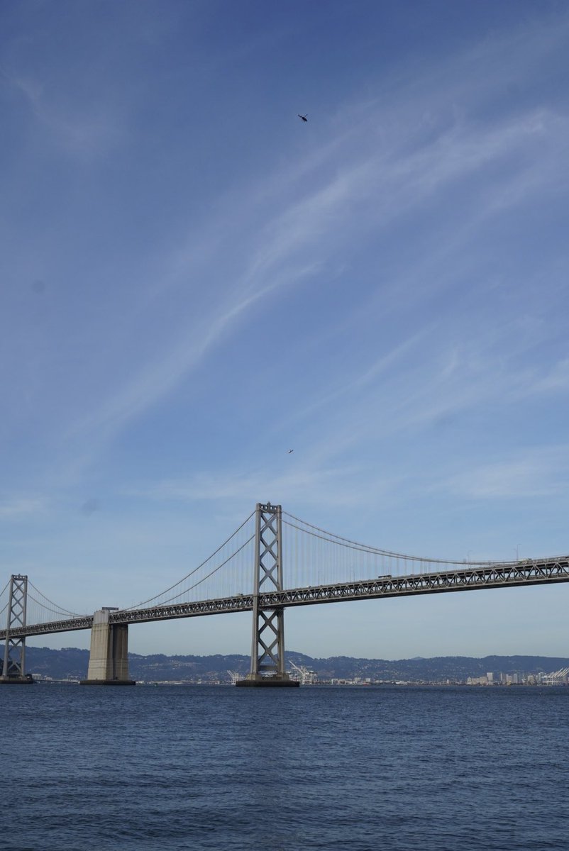 renepakmorrison's tweet photo. Two helicopters continue to circle over the Bay Bridge. Over an hour after arrests are made and traffic continues to inch along slowly with only two lanes open. I wish I had a telephoto lens on me right now #sfprotests https://t.co/XYOHWqw8En