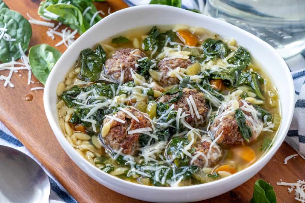 TaraNoland's tweet photo. Loaded with veggies and tiny meatballs this hearty, healthy Slow Cooker Italian Wedding Soup will quickly become a favorite! #recipe #Italianweddingsoup #soup #slowcooker #crockpot #meatballs https://t.co/zqqVL6oZxU https://t.co/BSG30Sln8o
