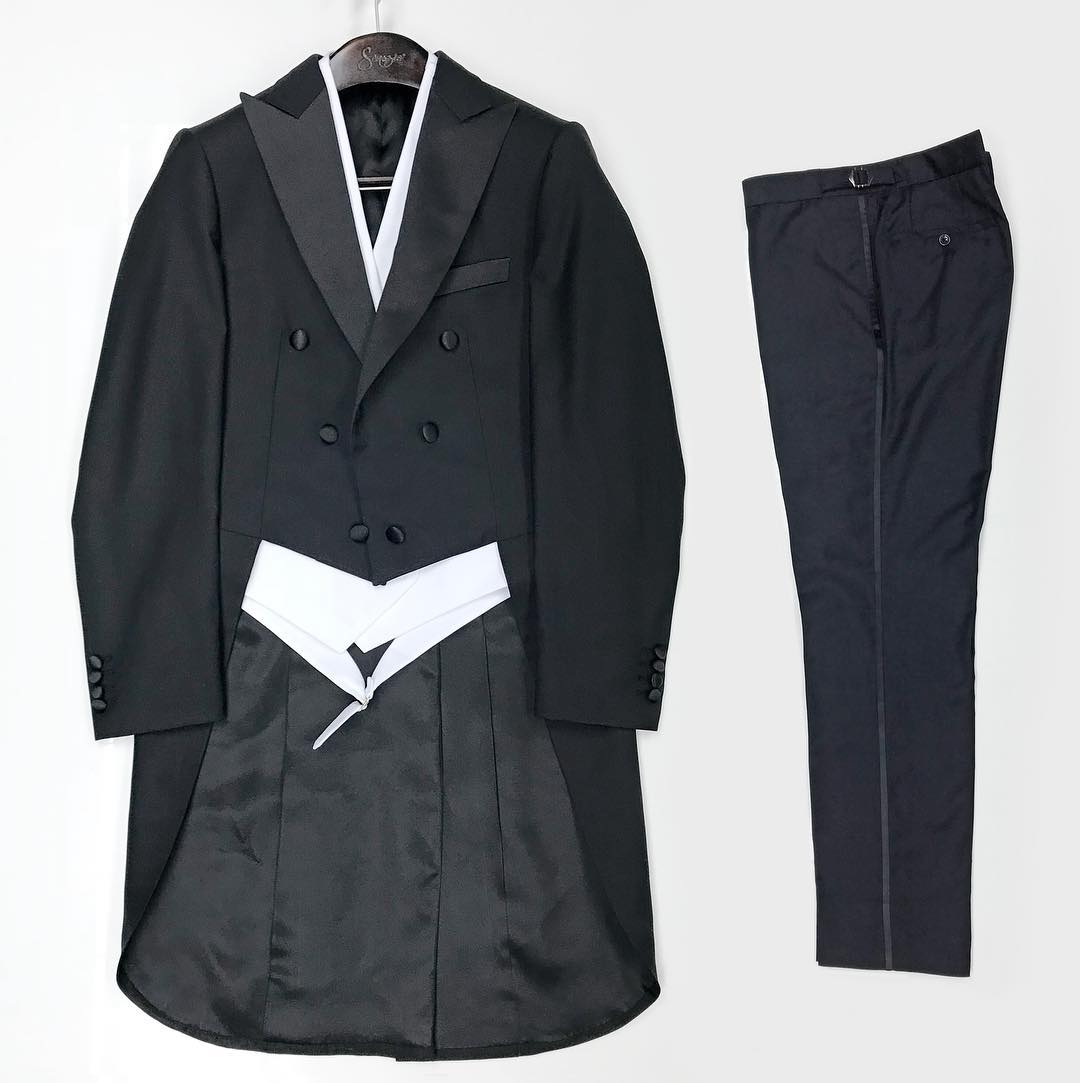 Not to be confused with a morning coat, this evening tailcoat is distinctly for a black tie affair. Used sparingly, it elevates a man to meet an occasion like no other piece of formal wear.
#blacktie #tuxedo #formalsuit