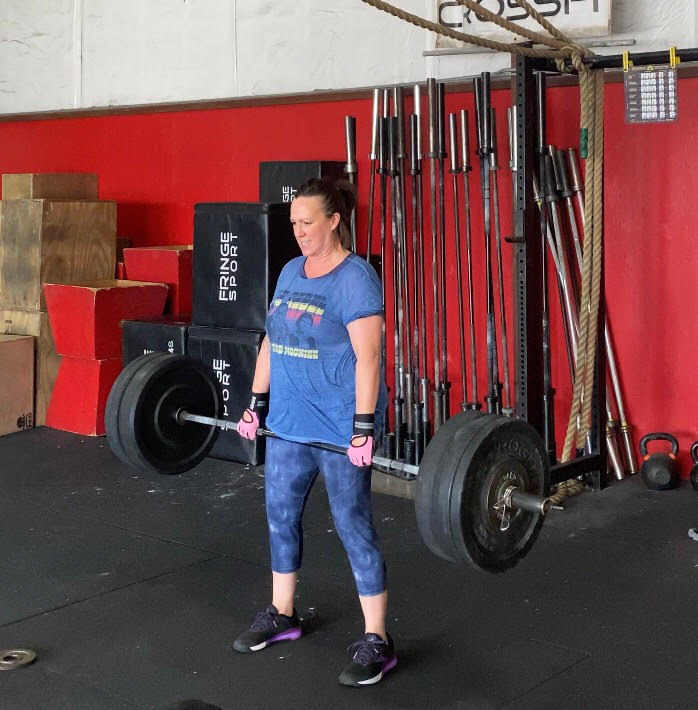 MJ Hegar lifting weights.