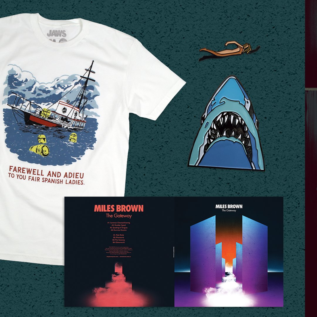 MondoNews's tweet photo. We're celebrating the 45th anniversary of JAWS with a re-press of John Williams’ classic score (feat. art by @PhantomCityCrtv), 2 new t-shirts (designed by Ryan Duggan &amp; Lou Feck) + a restock of our 2-pin set by @oliverbarrett! On Sale Weds at NOON (CT): https://t.co/r9Pvb1UCzZ https://t.co/AewyYm0S7w