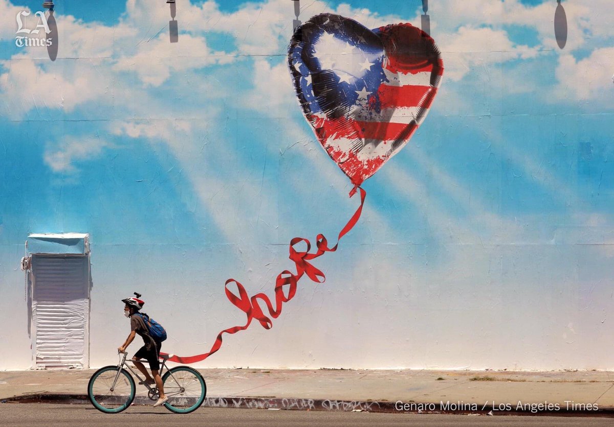 GenaroMolina47's tweet photo. A bicyclist rides past the latest mural created by Mr. Brainwash that tells Americans to remain hopeful in the time of the coronavirus pandemic in Los Angeles on June 15, 2020. Emily Dickinson lives. ⁦@latimes⁩ #LA #COVID #coronavirus #hope https://t.co/nsfDs09XQb