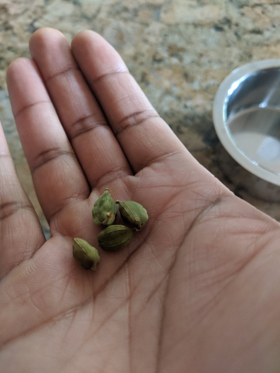 Take 3-4 cardamom cloves, break em open to get the seeds, crush them using a blunt object, like mortar and pestle (you can also grind in food processor) and add to pot.