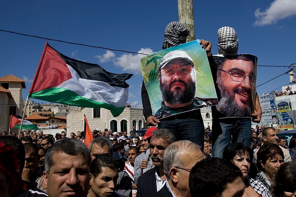 QassemsQassem's tweet image. Arabs carry portraits of Lebanese Hezbollah Chief Hassan Nasrallah and assasinated #Hezbollah military leader Imad #Mughniyeh during a demonstration to mark &quot;Land Day&quot; in the town of Sakhnin, near the coastal city of Haifa on March 30, 2010. ( AFP)