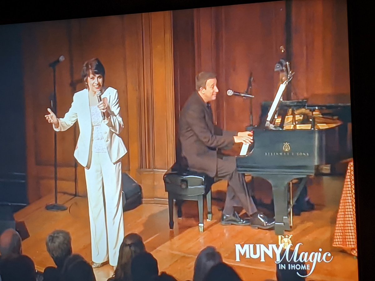 AngWxGrl's tweet photo. You know you married the right guy when, on his own, he makes a Step & Repeat background so we can "take" our baby to her first @TheMuny performance. Maybe I should have put on makeup. Now, who is going to bring us Ronnie's Rocky Mountains at intermission? #munymagic #muny2020 https://t.co/Ma4PcUbJ75