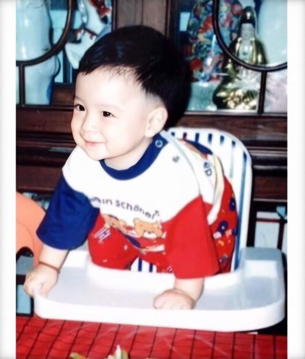 a baby on his chair and crib 