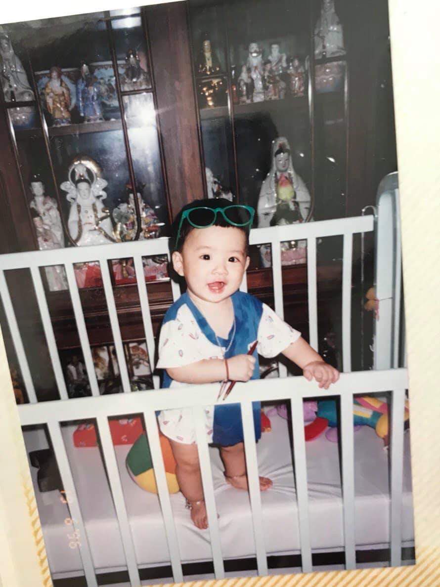 a baby on his chair and crib 